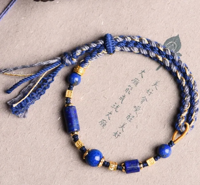 Hand-woven DIY watch band bracelet made from flexible wire in an ethnic lapis lazuli style.