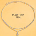 Gold adjustable waist chain with rhinestone water drop pendant and lobster clasp on mannequin