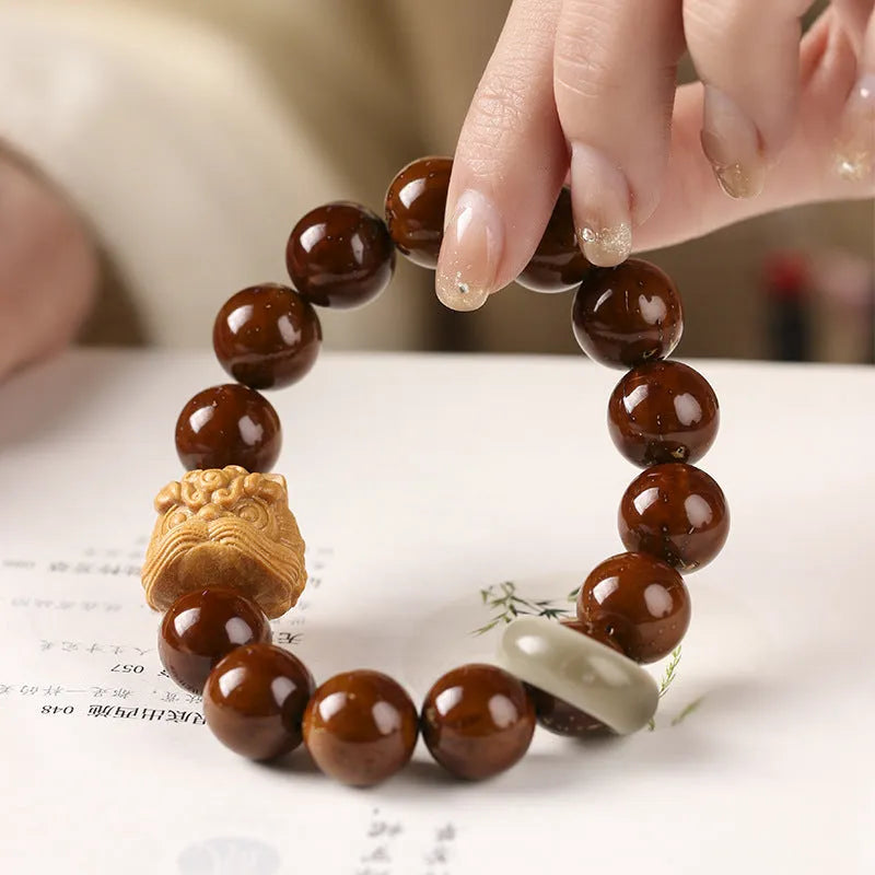 Hand-woven ivory nut lion round bead artistic bracelet with 13mm spherical beads