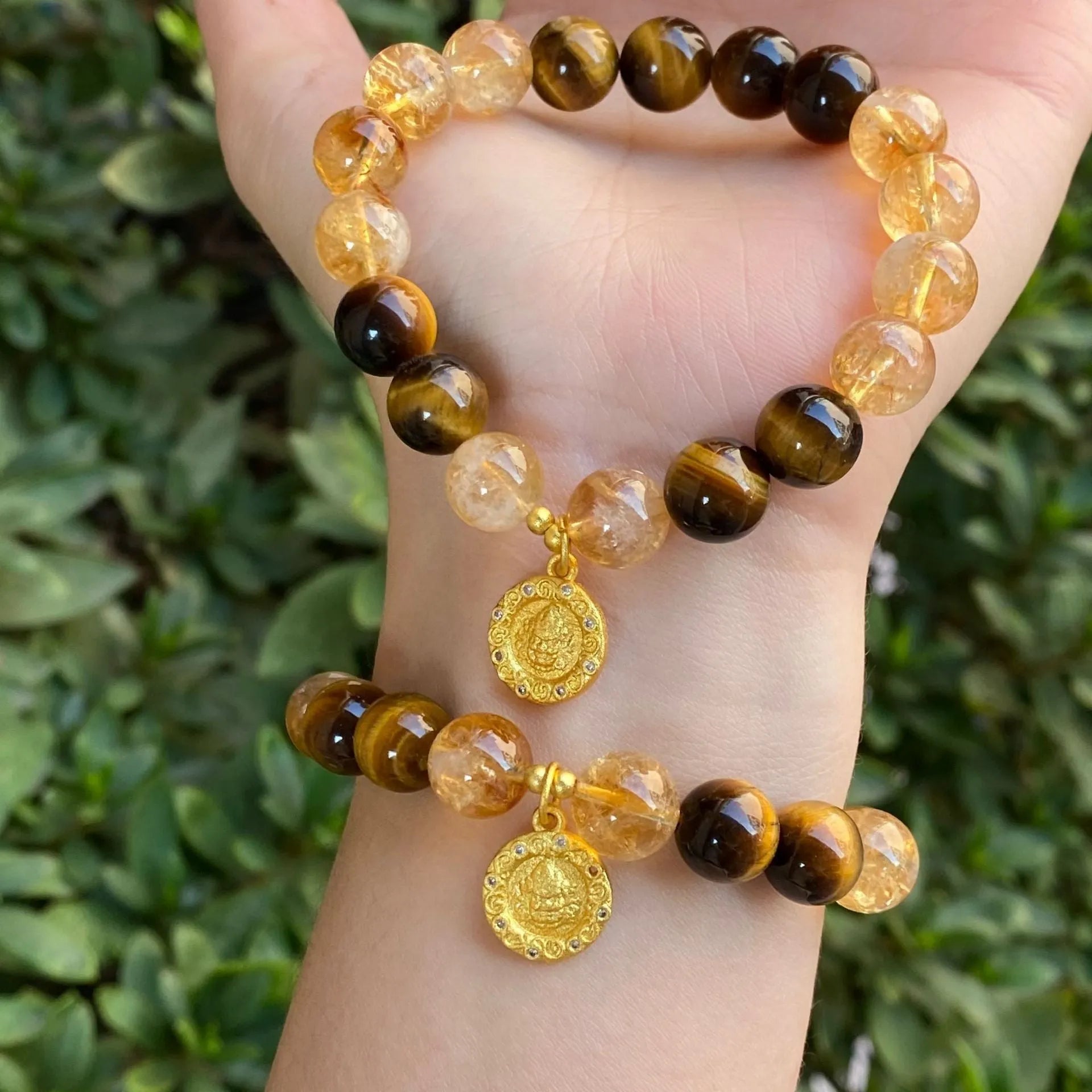 Handmade citrine bracelet with diamond-encrusted gourd bead, prayer wheel, and half mountain half water beads on a wrist