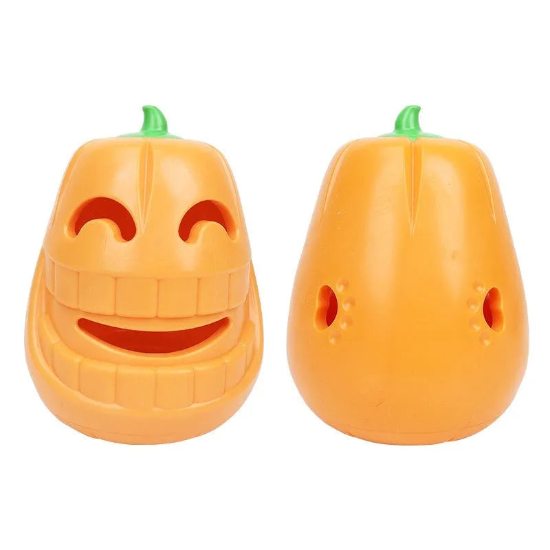 Orange Halloween pumpkin-shaped dog chew toy with treat-dispensing funnel opening