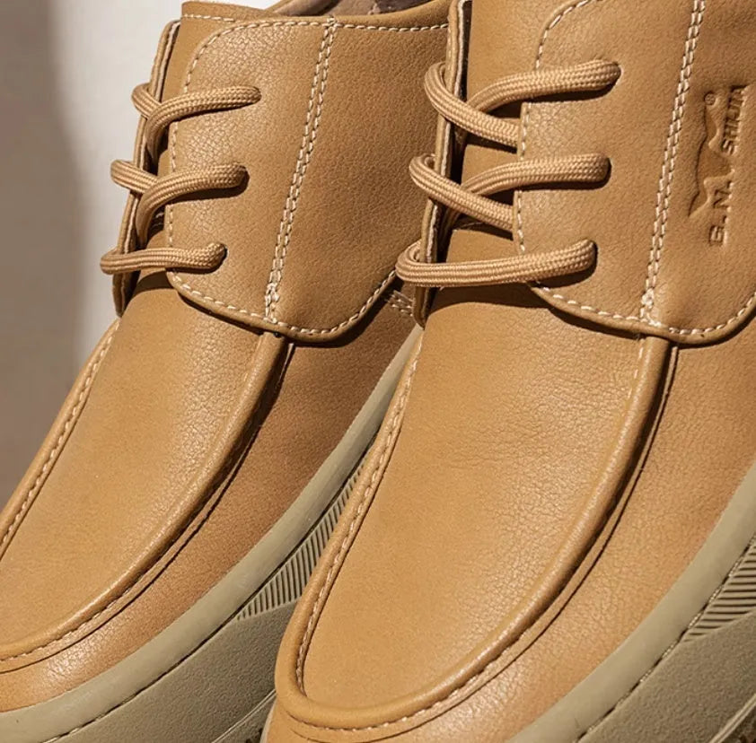 Brown retro leather casual shoes with big toe design and visible stitching on a rubber sole.