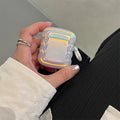 Colourful silicone protective case for Apple AirPods with a laser ring design on the front.