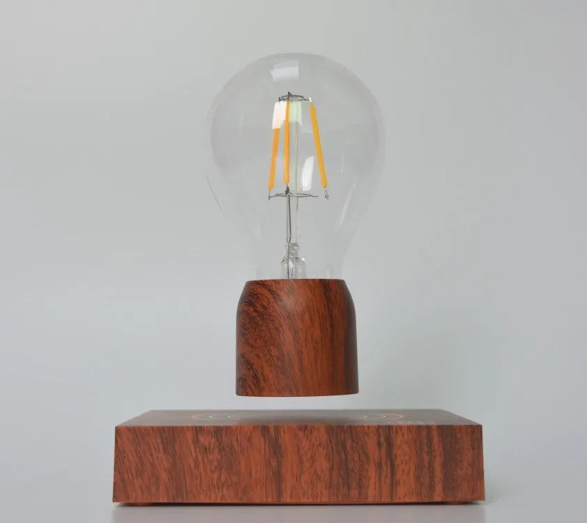 Magnetic levitation bulb floating above imitation wood base with ABS and glass construction, EU CE certified for 100-240V operation