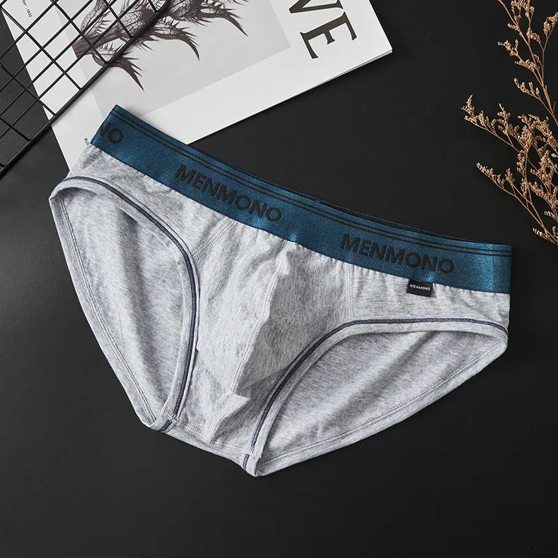 Men's low-waist cotton briefs in solid colours with a briefs style, showing breathable fabric and low-waist design.