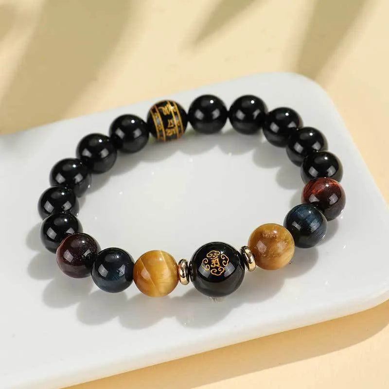 Handmade black agate beaded bracelet with tiger eye stones and Buddhist deity zodiac charms