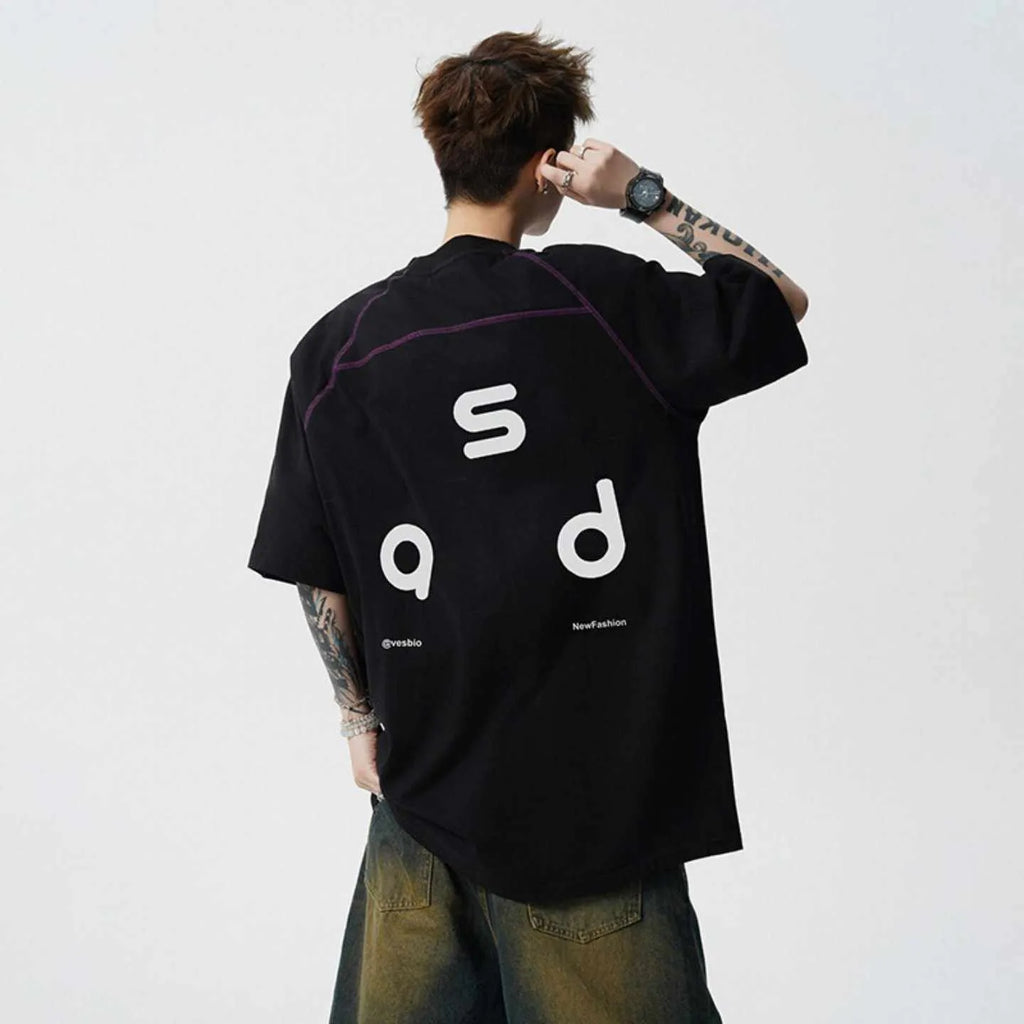 Men's loose fit black cotton T-shirt with a printed letter design on the front.