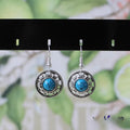 Handmade Miao silver turquoise geometric earrings with flower disk shape and totem patterns