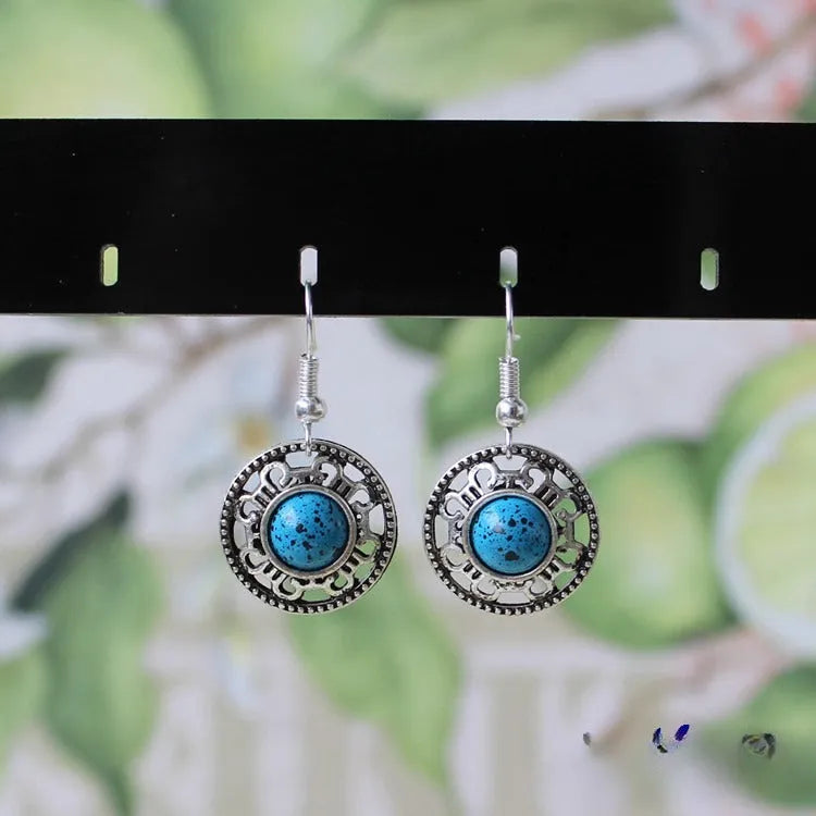 Handmade Miao silver turquoise geometric earrings with flower disk shape and totem patterns