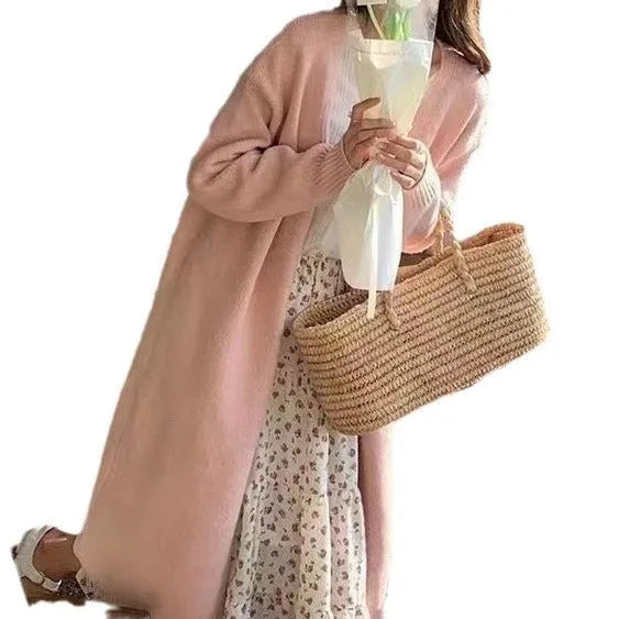 Women's knitted cardigan with V-neck, 65cm length, in khaki colour showing loose fit and long sleeves