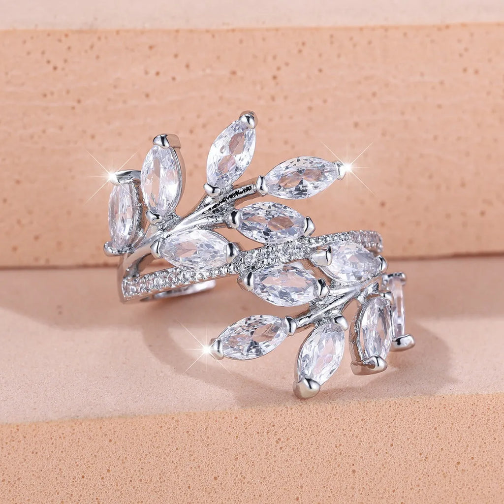 Adjustable copper leaf ring with horse eye zircon stones in multiple colour options showing botanical design