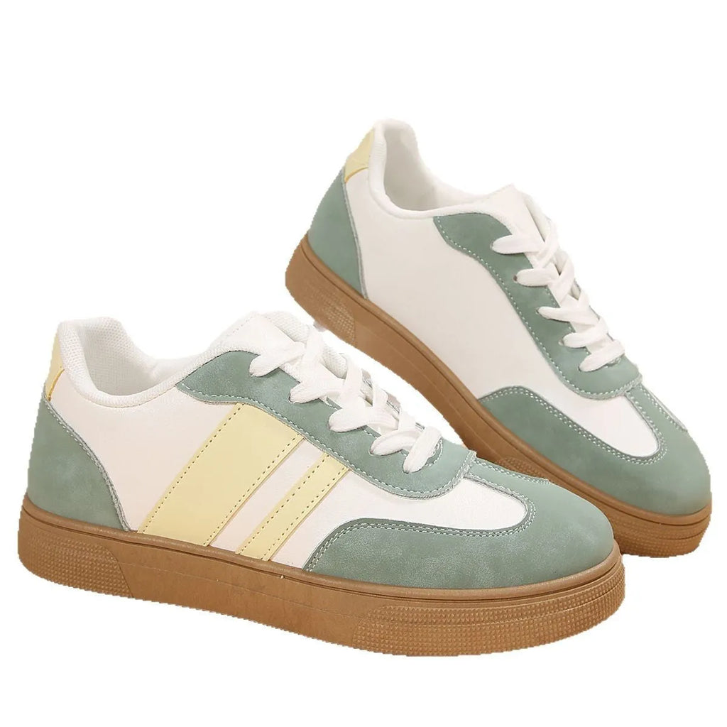 Women's low-top retro sports pumps in a candy colour with cross-strap detail on artificial PU upper.