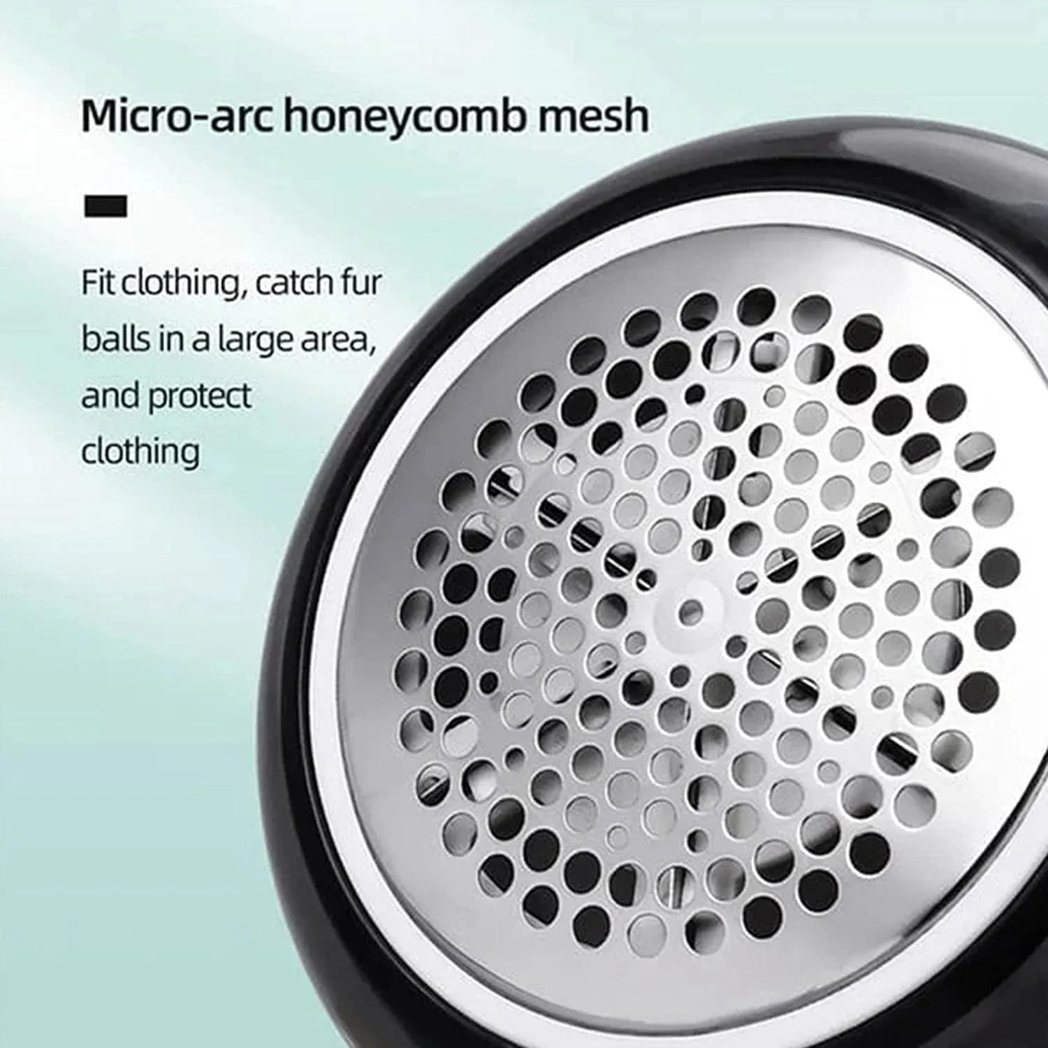 White USB rechargeable electric lint remover shaver with removable lint collector container on a sweater.
