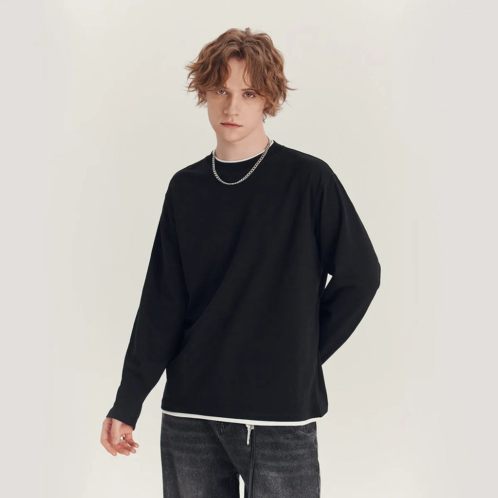 Men's loose fit long-sleeved cotton blend t-shirt on a hanger, shown in solid navy blue colour.