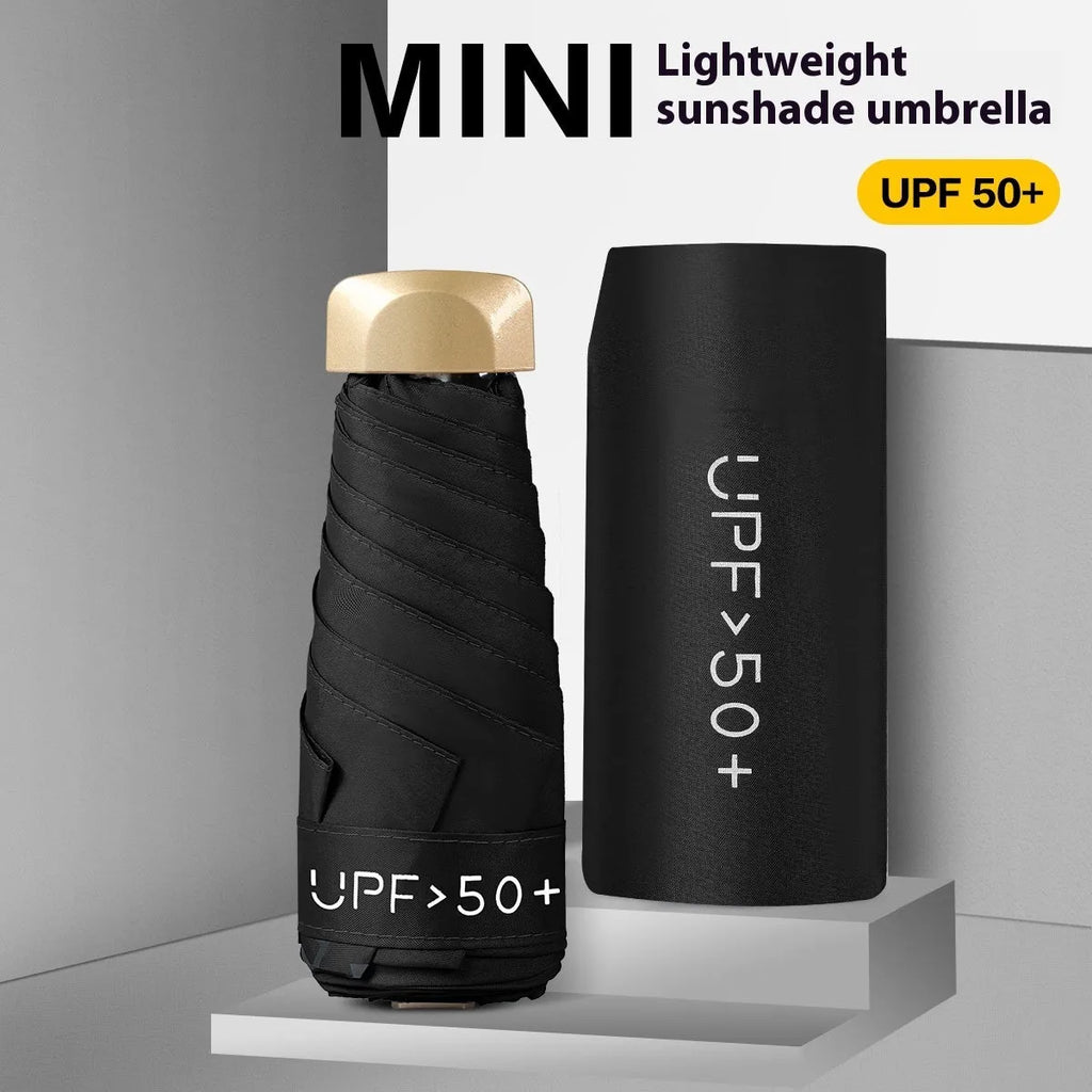 Closed five-fold compact sun umbrella with rubber handle, shown in a selection of colours.