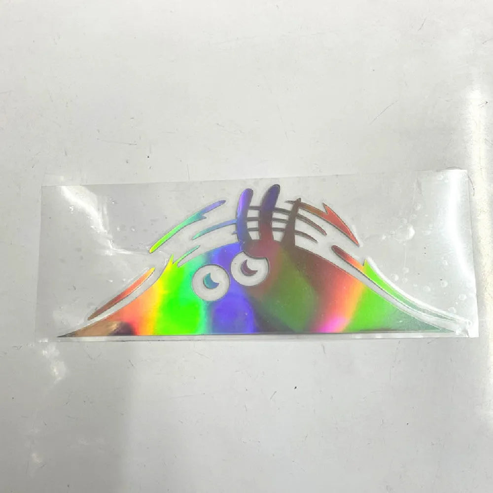 Self-adhesive body stickers showing four face designs on skin, each measuring 19cm by 7cm