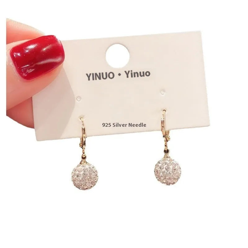 A pair of geometric-shaped zircon and rose element earrings for women, made from electroplated copper.