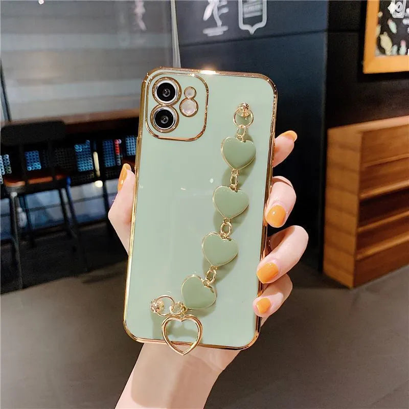 Solid colour silicone mobile phone case with an attached wrist strap for Samsung Galaxy smartphones.