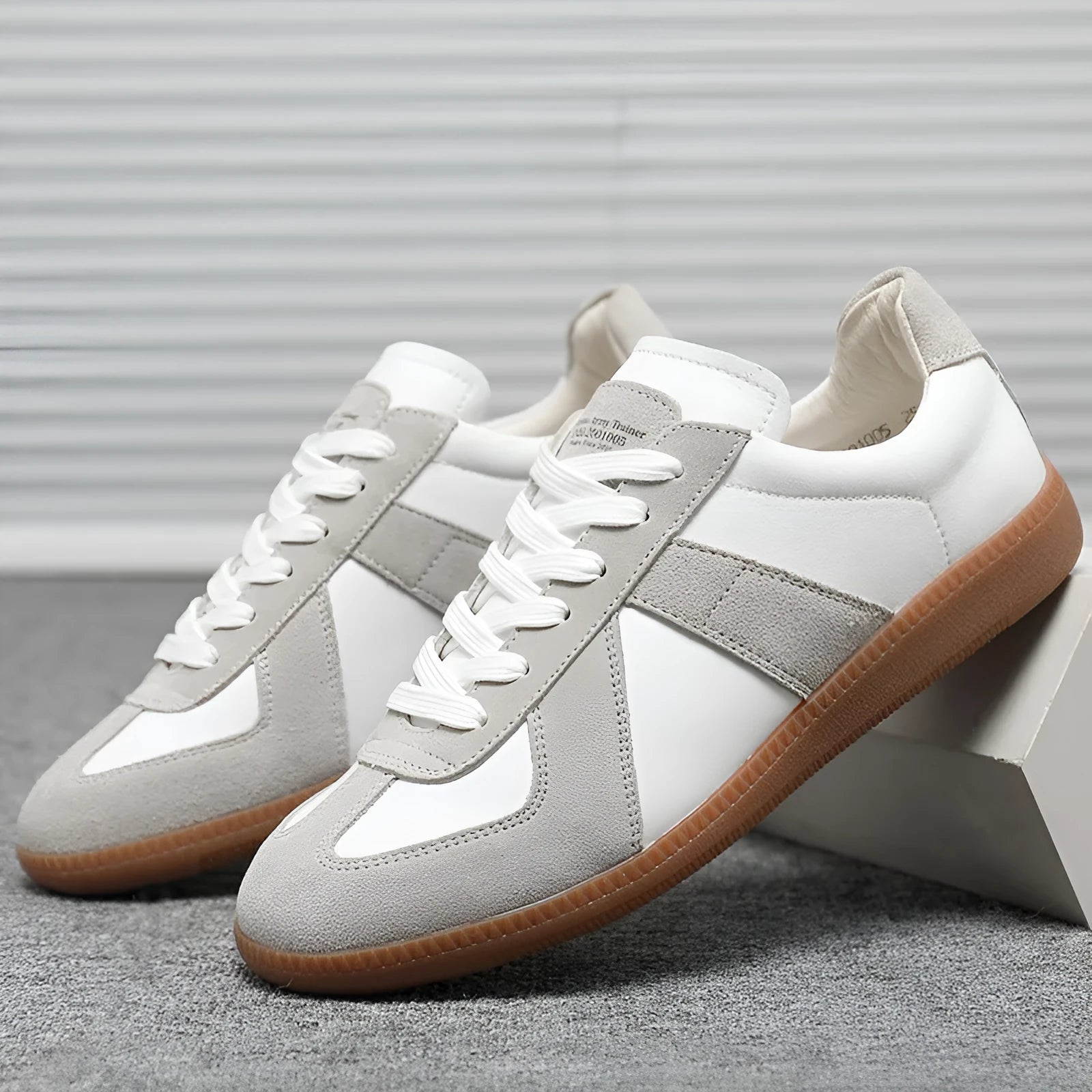 White Japanese-style retro unisex board shoes with lace-up front and round toe on a rubber sole.