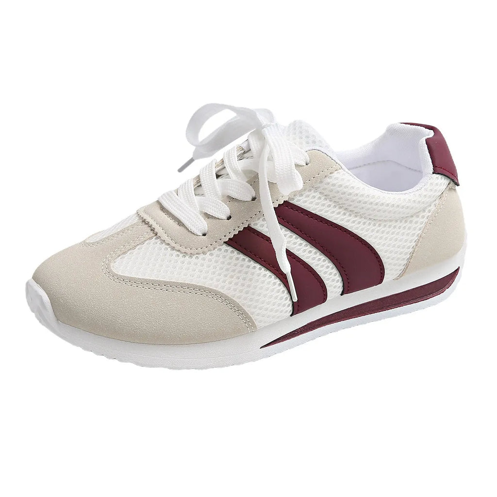 Wine red Cortez Retro low-top sneakers with cross-strap detail on synthetic leather upper.