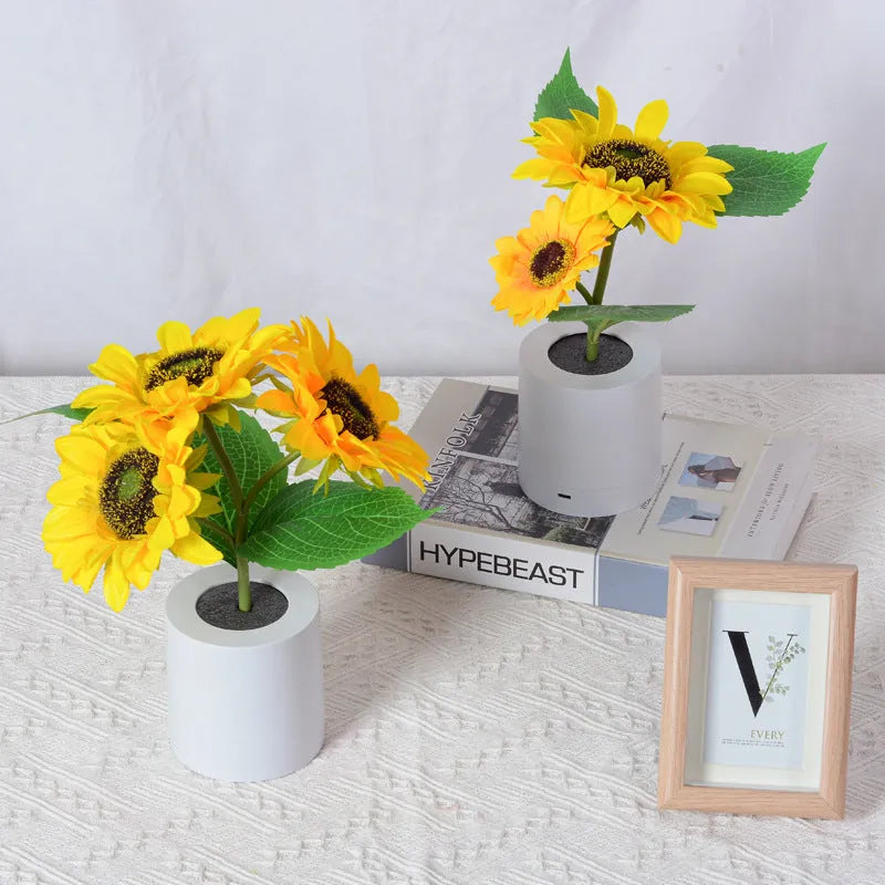 Rechargeable artificial sunflower LED night light on a table