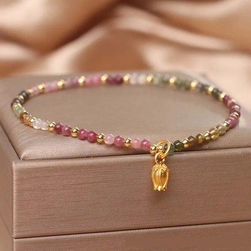 Natural tourmaline beaded adjustable anklet and bracelet set with floral charm detail