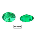 Cultivated emerald gemstones in round and grandmother cut shapes showing Columbia green colour