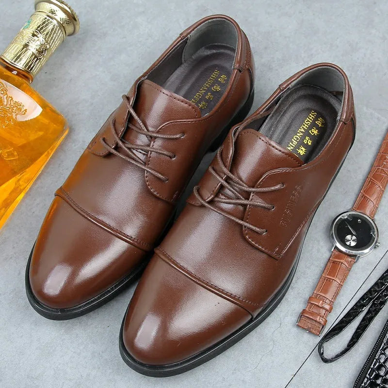 Men's black leather lace-up shoe with decorative stitching and a horse buckle on a rubber sole.