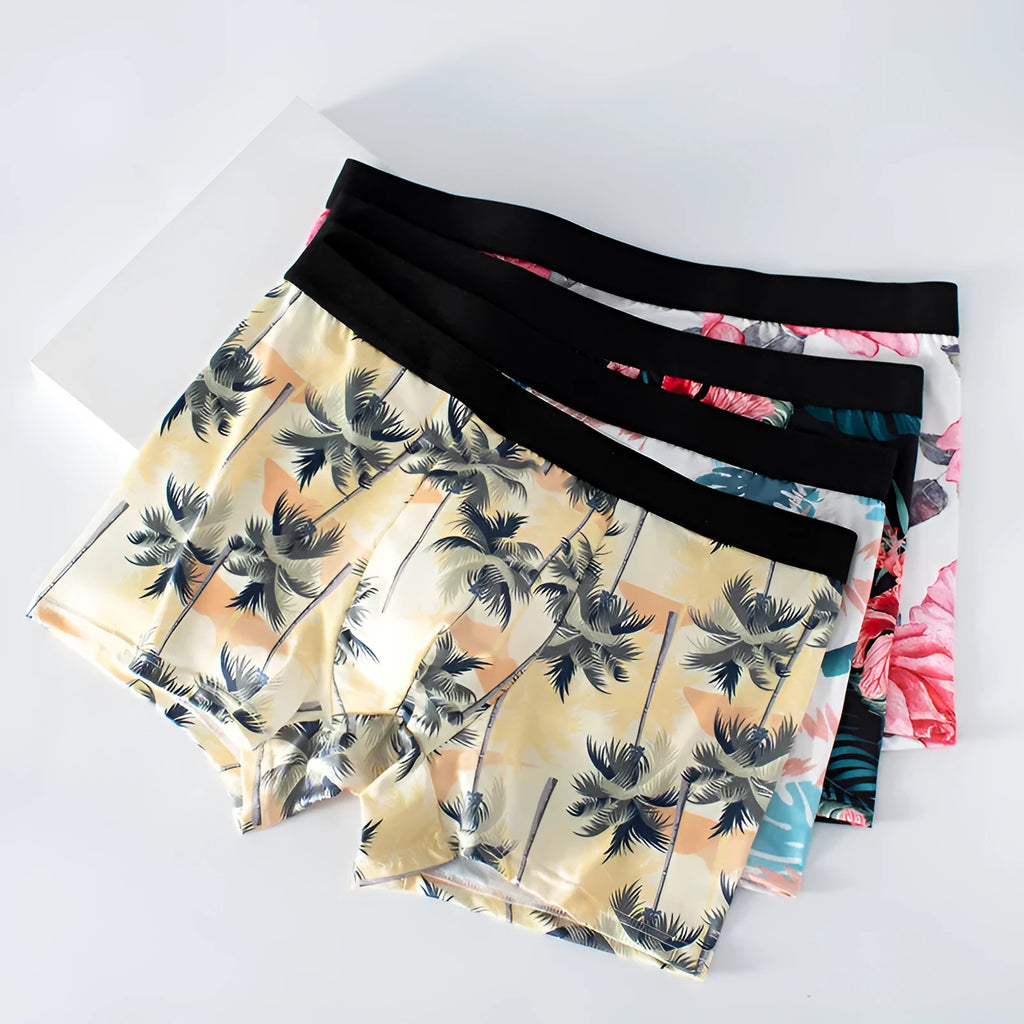Men's ice silk underwear with fashion printing in polyester fabric showing breathable mid-waist design