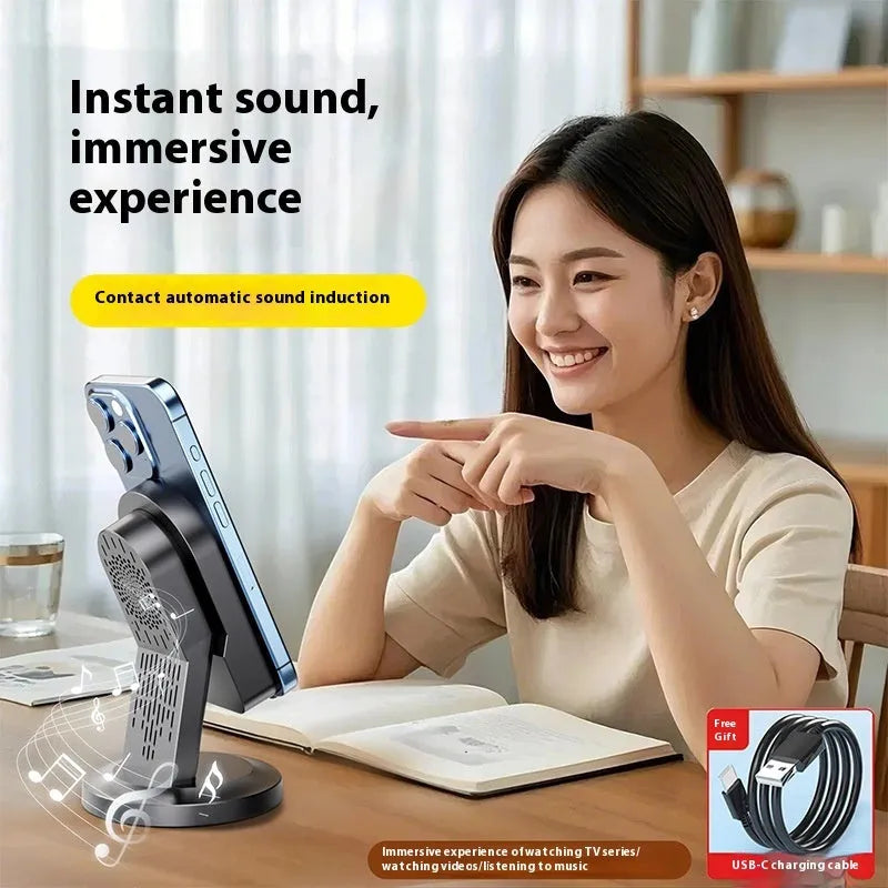 Three-in-one wireless induction speaker and Bluetooth phone bracket in black or white, common or mirror style, with built-in battery and USB cable.