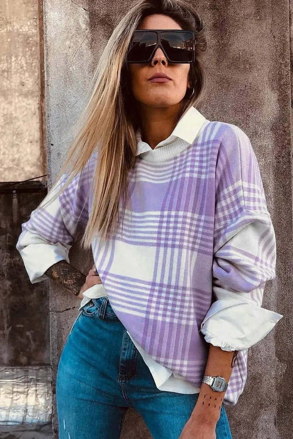 Lilac plaid print loose sweater with ribbed trim and long sleeves, shown in a relaxed fit.