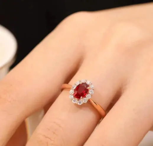 Women's sterling silver ring with gold pigeon blood ruby gemstone and floral pattern design