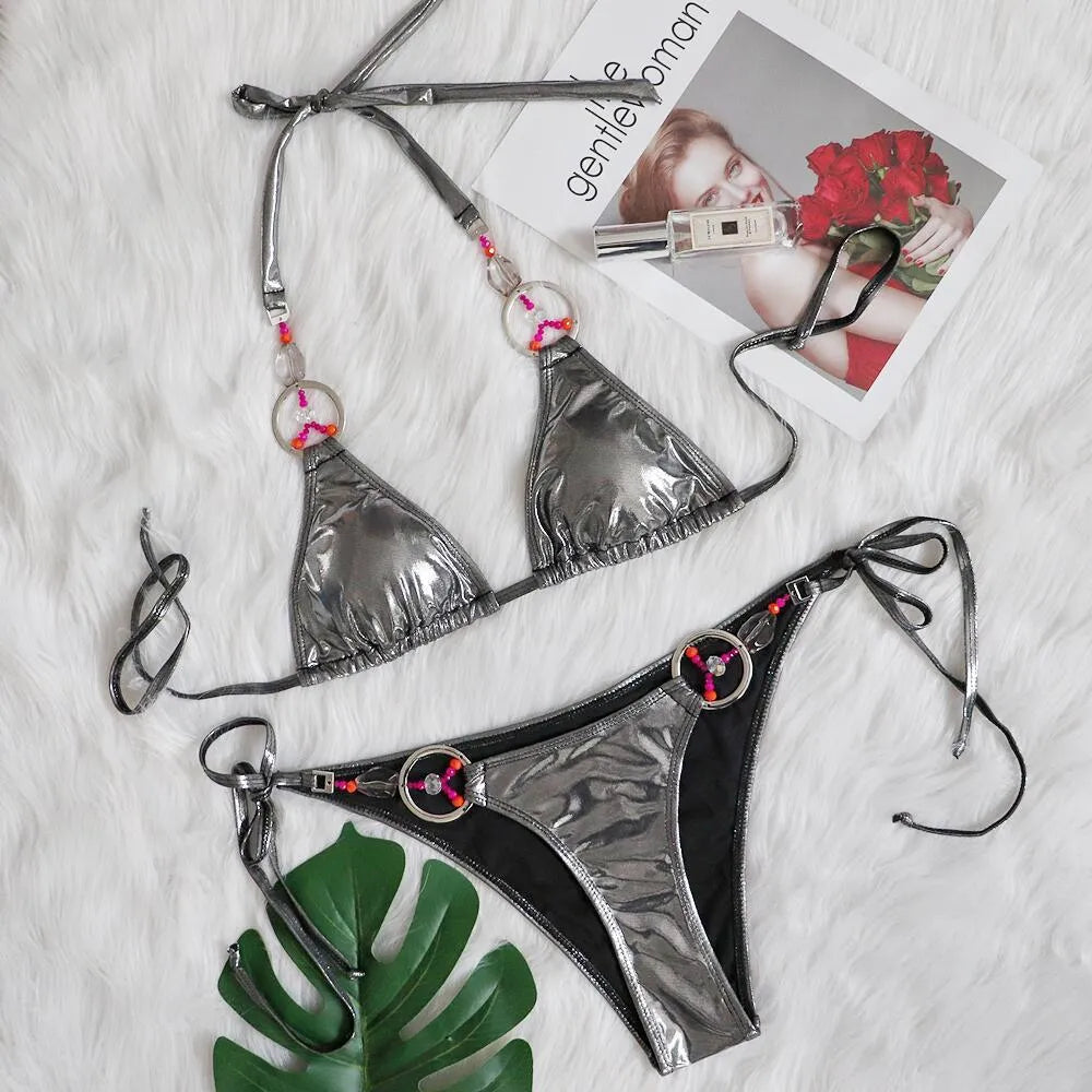 Silver women's bikini swimsuit with split-style briefs on mannequin