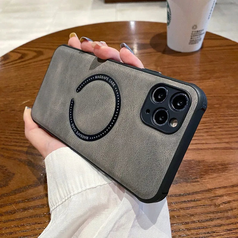 Black imitation leather magnetic charging case for iPhone on a magnetic charging puck