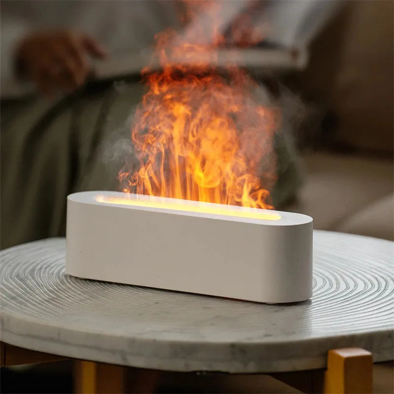White square DQ709 flame effect aroma diffuser and ultrasonic cool mist humidifier on a table.
