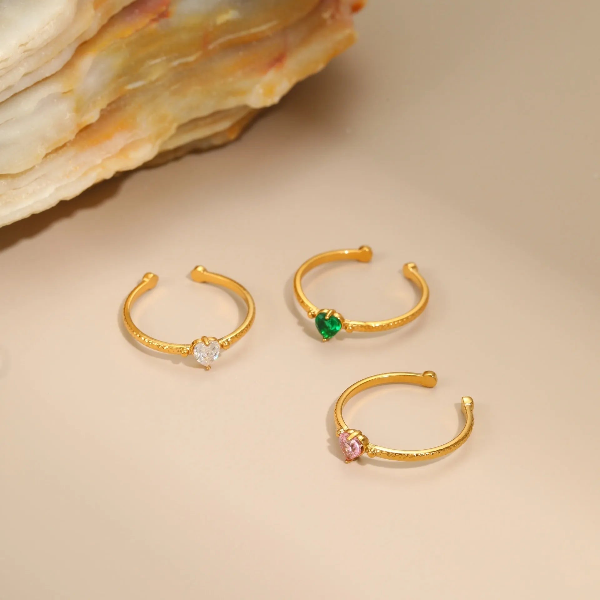 Open ended heart ring with zircon stones in stainless steel, showing adjustable free size design