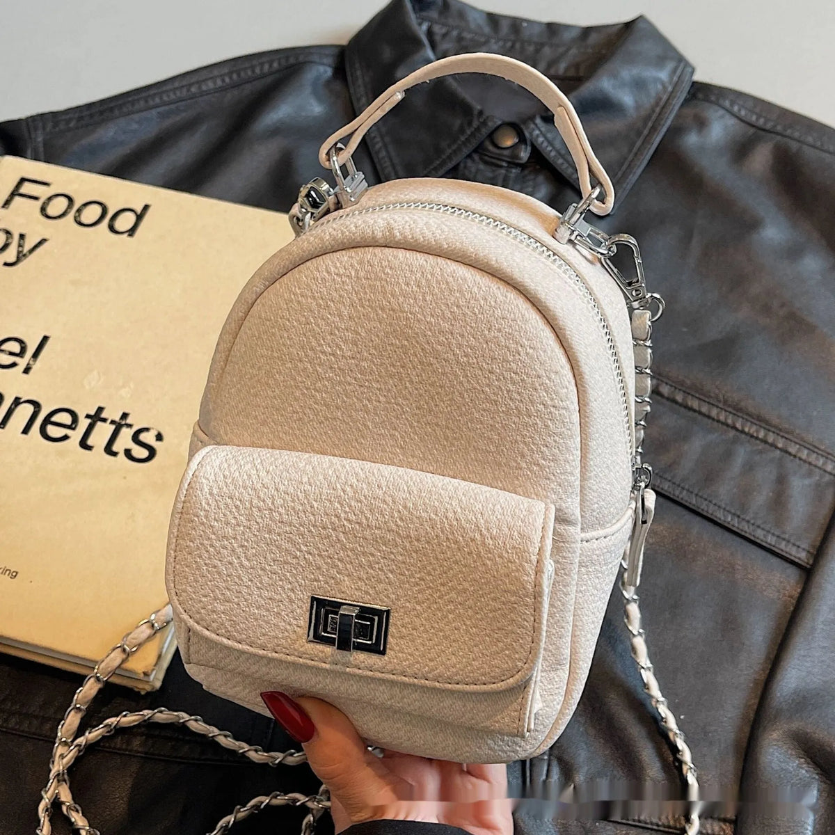 Korean style solid colour PU casual backpack with three-dimensional pocket, shown in black, beige, blue, dark blue or khaki.