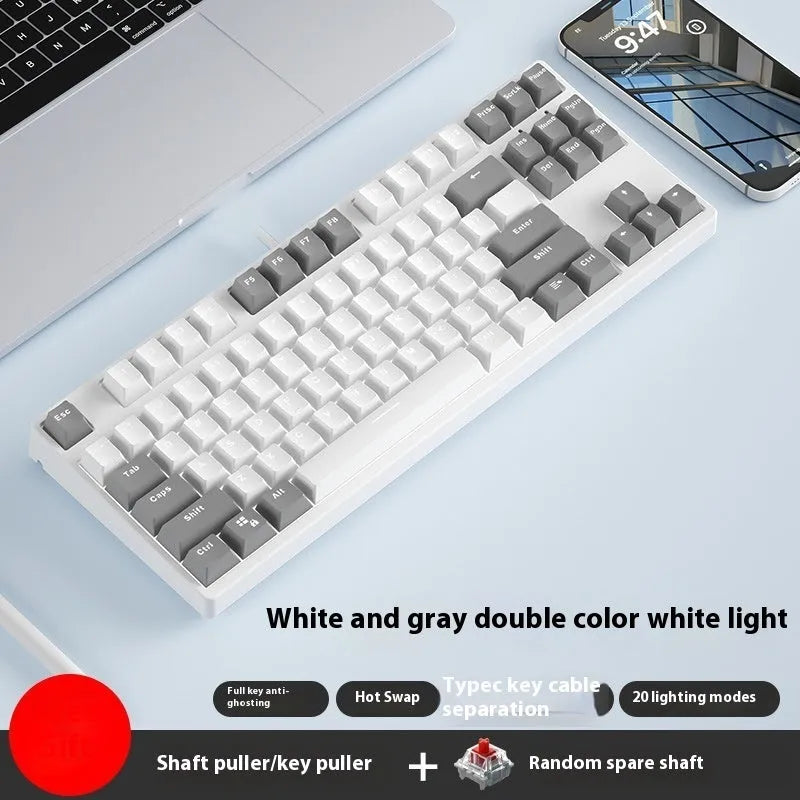 87-key wired mechanical keyboard with two-tone keycaps and metal frame, showing compact design and included tools