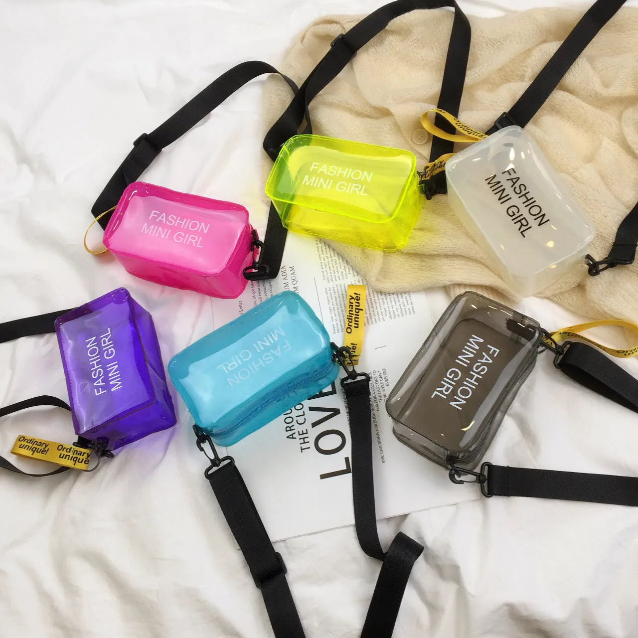 Transparent square jelly shoulder bag with adjustable strap in multiple colour options showing 19cm width dimensions