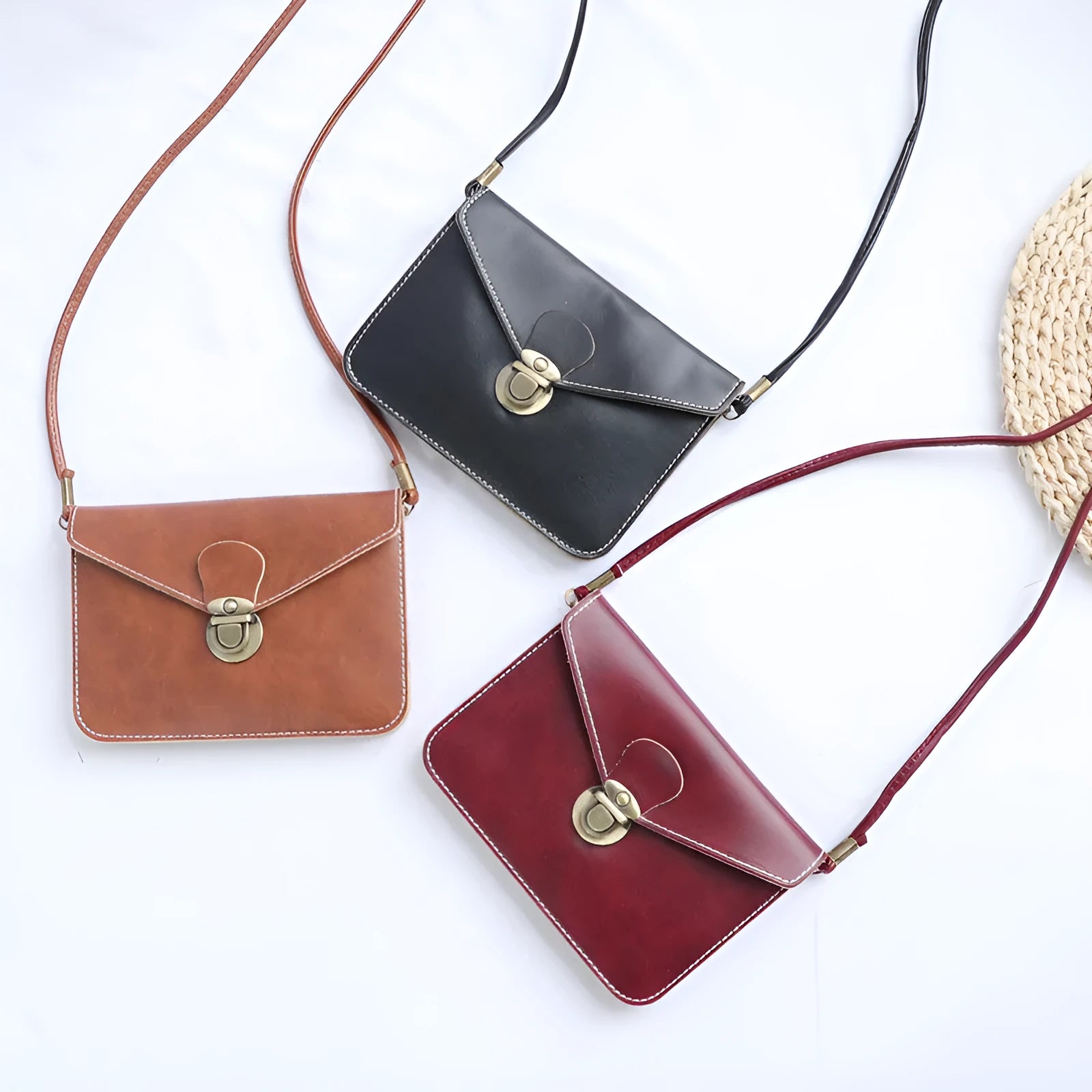 Retro soft-surface crossbody messenger bag with flap closure and lock detail in wine red colour