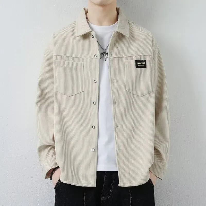 Men's black corduroy cardigan jacket with long sleeves laid flat