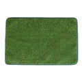 Green washable dog grass pee pad on a patio for pet potty training