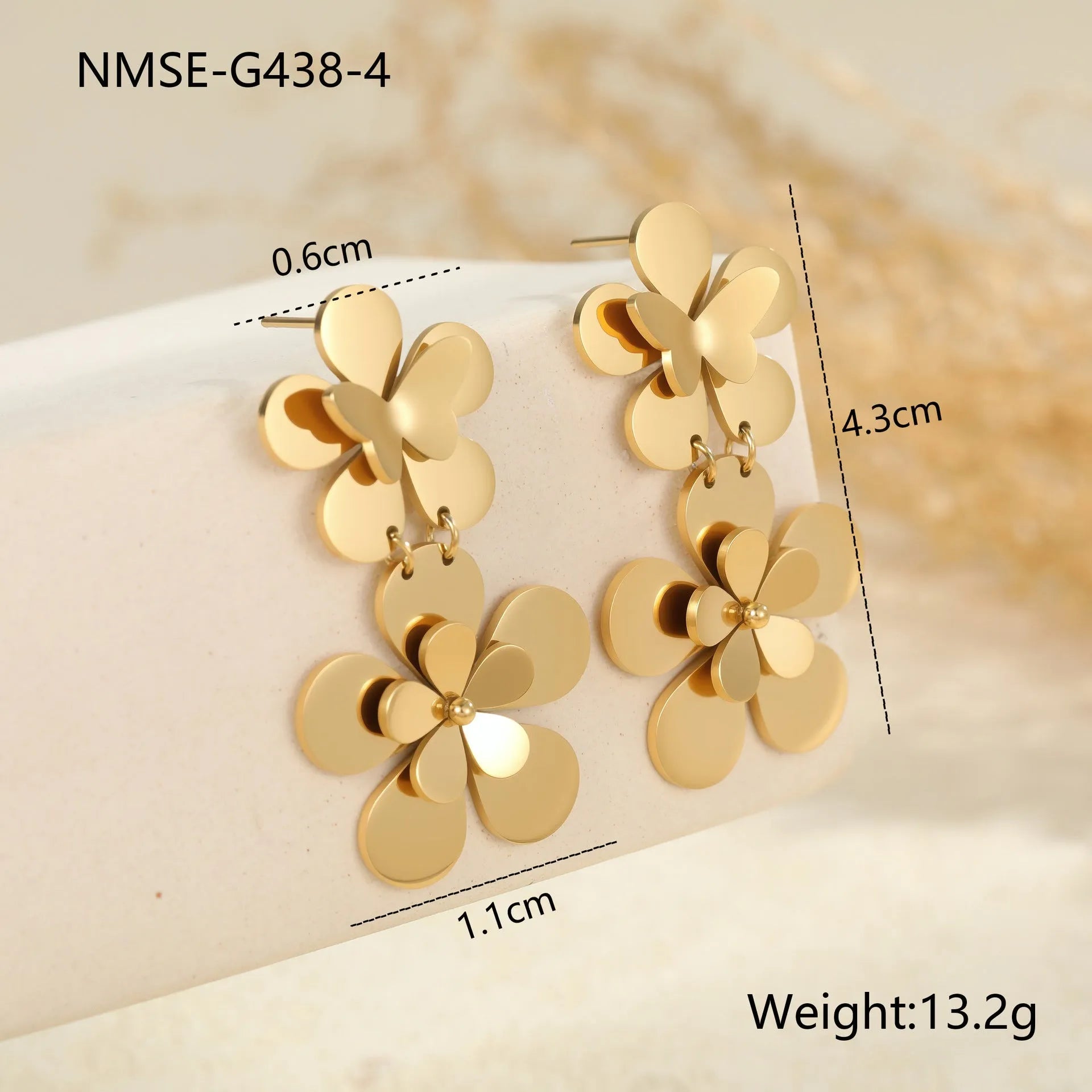 Gold-coloured stainless steel women's earrings with butterfly and flower geometric design