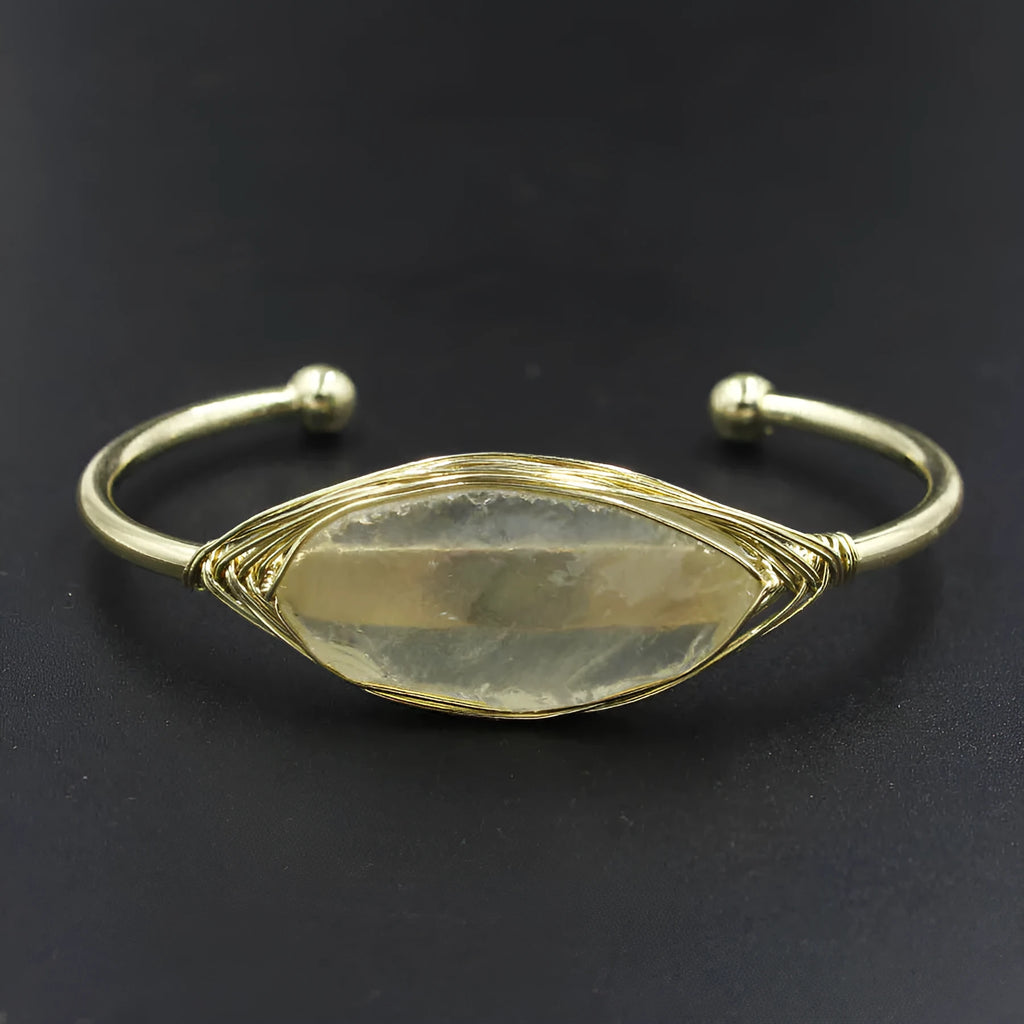 Natural raw gemstone bracelet with 8mm amorphous crystals in various colours on a wrist, showing ethnic style and simple clasp.