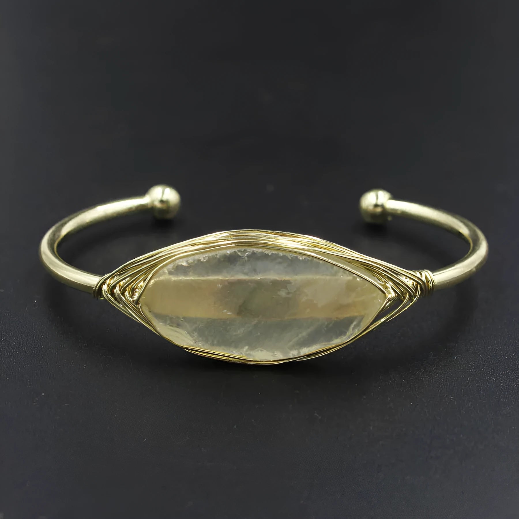 Natural raw gemstone bracelet with 8mm amorphous crystals in various colours on a wrist, showing ethnic style and simple clasp.