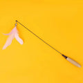 Cat teasing stick with wooden handle, flexible metal spring, and feather bell replacement head