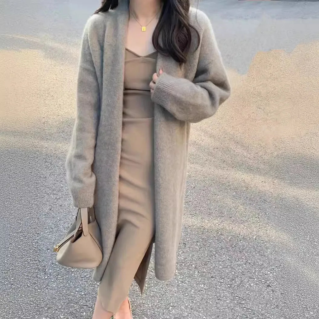 Women's knitted cardigan with V-neck, 65cm length, in khaki colour showing loose fit and long sleeves