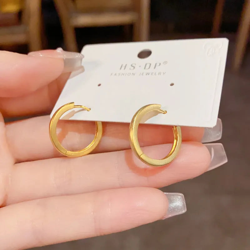 Women's geometric ear clips with round elements in gold and silver colours, real gold-plated copper construction