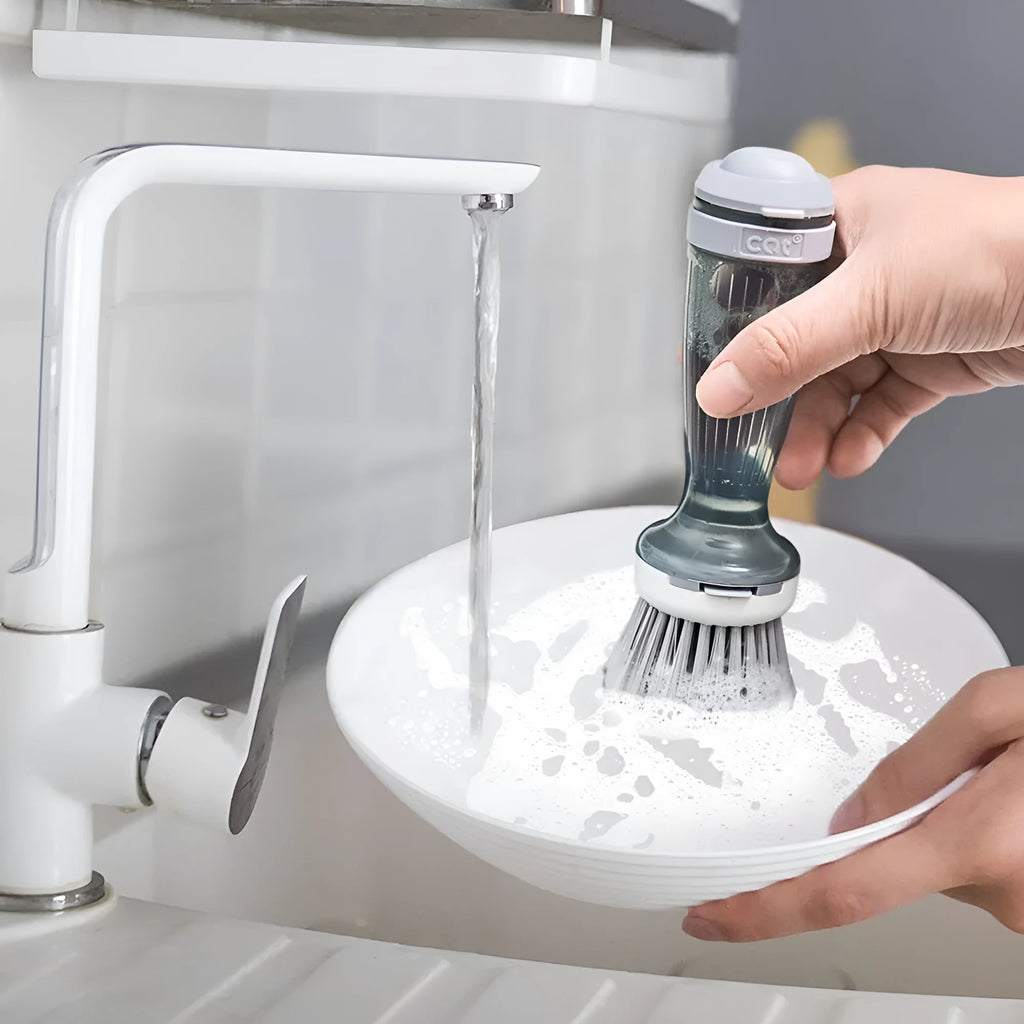 Milk white and mint green kitchen pot brush with soap dispenser in handle and replaceable brush head.