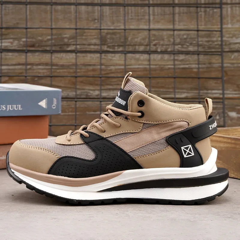 Low-top black safety work boot with lace-up front and steel toe cap on a construction site background.